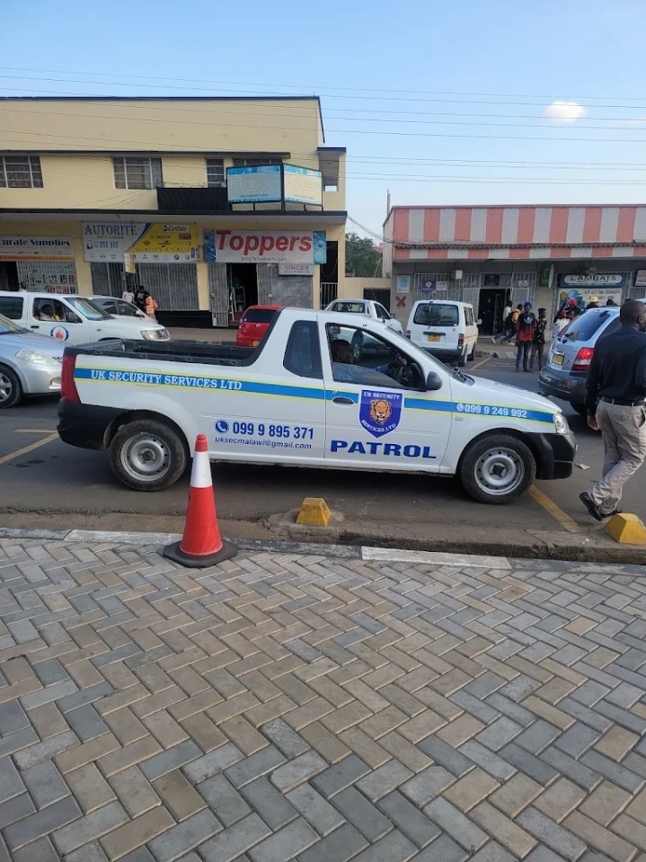 UK Security Services branded patrol vehicle parked on a Blantyre street